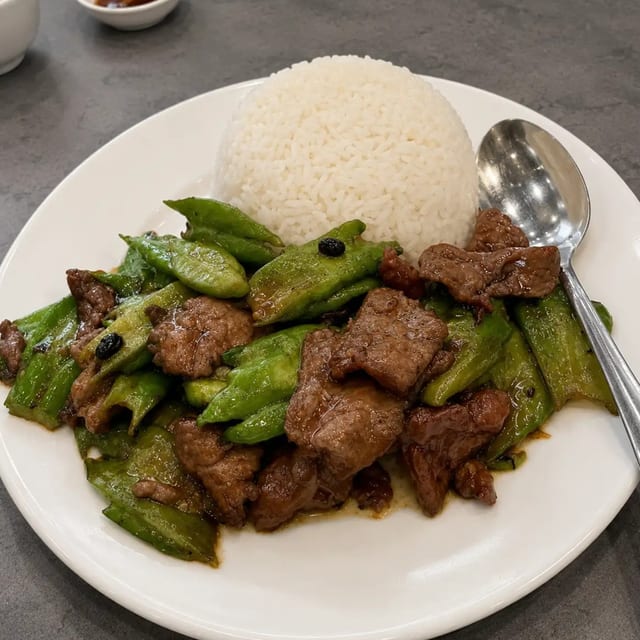 Stir-Fried Bitter Melon & Beef With Black Bean Sauce Over Rice.