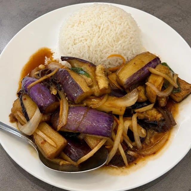 Eggplant With Garlic Sauce Over Rice.